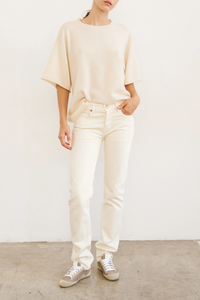 front profile model wearing The Cashmere Short Sleeve Tee Creme Loose shape tee shirt shape
Lightweight cashmere
100% Cashmere
