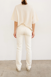 back profile model wearing The Cashmere Short Sleeve Tee Creme Loose shape tee shirt shape
Lightweight cashmere
100% Cashmere
