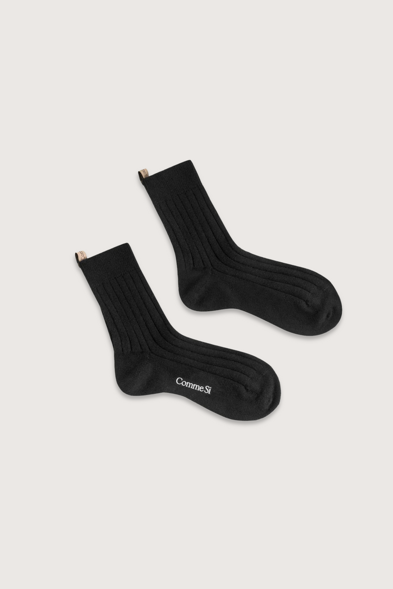flat lay The Cashmere Sock Black black cashmere ribbed with logo ribbon tab