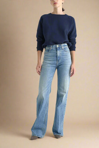 front profile model wearing The Crease relaxed flare Jean Worn Indigo