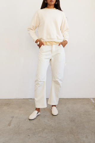 front profile model wearing The Daily Sweat Shirt Ecru Piece dyed for a saturated hue that maintains it’s color
100% Japanese cotton terry
Preshrunk
Relaxed fit
Shrunken in length, relaxed in width
Bracelet length sleeves
Crewneck