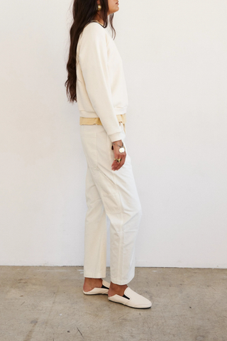 side profile model wearing The Daily Sweat Shirt Ecru Piece dyed for a saturated hue that maintains it’s color
100% Japanese cotton terry
Preshrunk
Relaxed fit
Shrunken in length, relaxed in width
Bracelet length sleeves
Crewneck