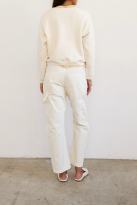 back profile model wearing The Daily Sweat Shirt Ecru Piece dyed for a saturated hue that maintains it’s color
100% Japanese cotton terry
Preshrunk
Relaxed fit
Shrunken in length, relaxed in width
Bracelet length sleeves
Crewneck
