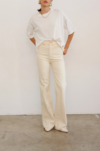 front profile model wearing The Draped Tee white High crew
Dolman tee elbow sleeve silhouette
Dolman shaped body cotton modal blend