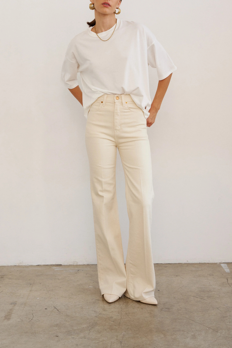 front profile model wearing The Draped Tee white High crew
Dolman tee elbow sleeve silhouette
Dolman shaped body cotton modal blend