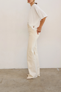 side profile model wearing The Draped Tee white High crew
Dolman tee elbow sleeve silhouette
Dolman shaped body cotton modal blend