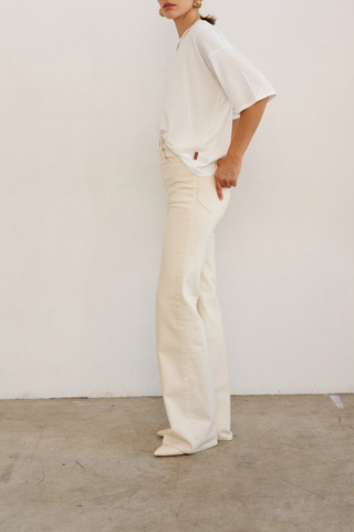 side profile model wearing The Draped Tee white High crew
Dolman tee elbow sleeve silhouette
Dolman shaped body cotton modal blend