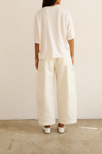 back profile model wearing The Draped Tee white High crew
Dolman tee elbow sleeve silhouette
Dolman shaped body cotton modal blend