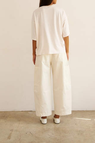 back profile model wearing The Draped Tee white High crew
Dolman tee elbow sleeve silhouette
Dolman shaped body cotton modal blend