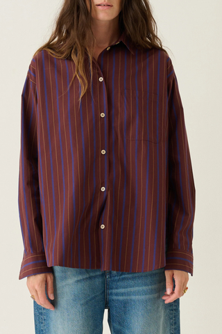 front profile model wearing  The Essential Striped Shirt Oxblood Relaxed fit
Beautiful drape
Perfectly placed button at the chest
Button just under the collar
Small button perfectly placed on the cuff placket
93% Cotton 7% Silk