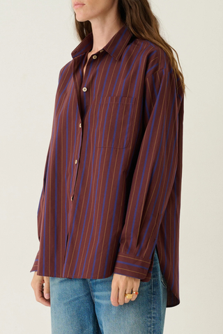 side profile model wearing  The Essential Striped Shirt Oxblood Relaxed fit
Beautiful drape
Perfectly placed button at the chest
Button just under the collar
Small button perfectly placed on the cuff placket
93% Cotton 7% Silk