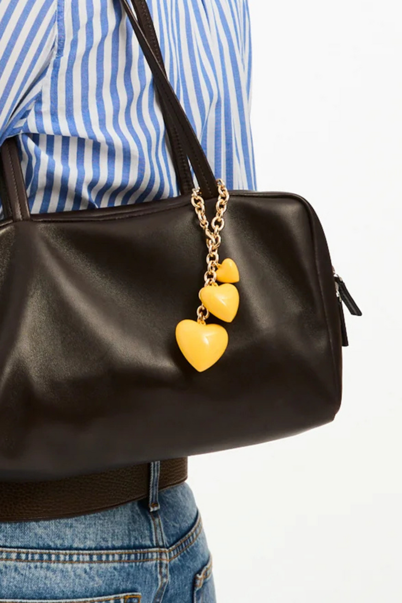 model wearing The Happy Bag Charm Yellow