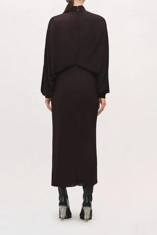 back profile model wearing The Helena Dolman Jersey Dress ganache brown Midi-length
High neckline
Draped bodice
Gathered waist
Sleeves taper at the cuffs
Invisible center-back zipper
Covered button closures at back neck
Bodice and skirt are self-lined