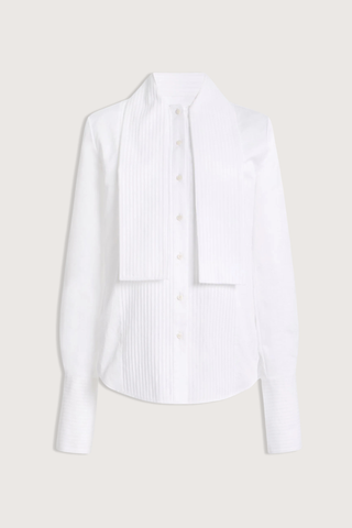 flat lay The Inez Tuxedo Shirt With Tie Neck Scarf white cotton poplin Crisp shirting
Tuxedo-inspired silhouette
Pintucked front detailing
Integrated neck scarf
Pointed collar
Long sleeves
Elongated pintucked cuffs
Button-front closure
Curved shirttail hem