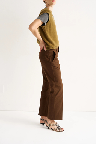 side profile model wearing  The Kick Trouser brown Straight leg trouser
Baby kick flare at the hem
Tailored with a pressed crease
Ankle length
Slightly cropped
Italian Stretch Twill
98% Cotton 2% Elastane