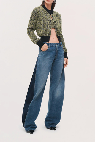 angled profile model wearing The Lana Trouser Denim bi-color blue mid wash
Wide-leg
Split seam construction
Integrated side pleats 
Classic five-pocket construction
Back darts in place of a traditional denim yoke
Brown denim back patch
Zip fly with button closure
100% Cotton