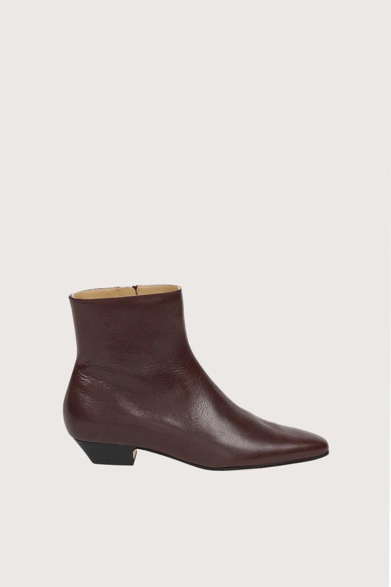 side profile The Lennon Boot Oxblood Leather upper
Elongated toe
Inner side zipper
Cuban heel
Long and lean
Handmade in Italy
Leather sole with integrated rubber anti slip injection
Stacked leather heel