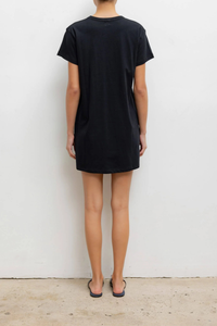 back profile model wearing The Margo Dress black 
Mini length
Hits mid-thigh
Clean crew neckline
Structured short sleeves
Slightly boxy fit
100% Cotton