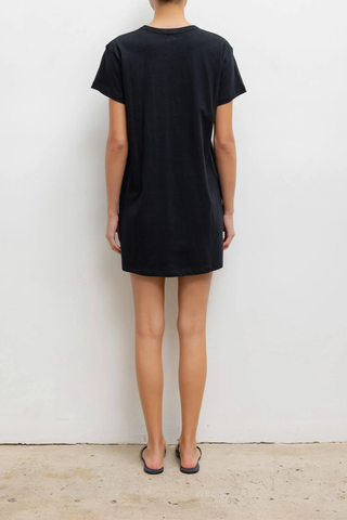 back profile model wearing The Margo Dress black 
Mini length
Hits mid-thigh
Clean crew neckline
Structured short sleeves
Slightly boxy fit
100% Cotton