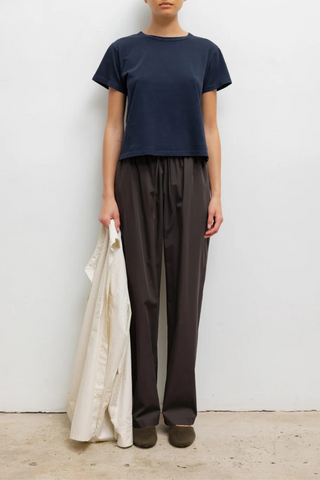 front profile model wearing The Margo Tee Midnight blue cotton relax classic fit