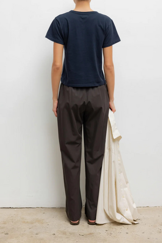 back profile model wearing The Margo Tee Midnight blue cotton relax classic fit