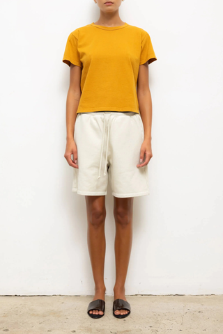 front profile model wearing The Margo Tee Mustard Classic, relaxed fit
Crewneck
short sleeve
100% Cotton