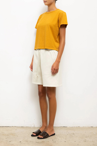 side profile model wearing The Margo Tee Mustard Classic, relaxed fit
Crewneck
short sleeve
100% Cotton