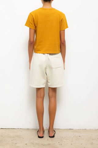 back profile model wearing The Margo Tee Mustard Classic, relaxed fit
Crewneck
short sleeve
100% Cotton