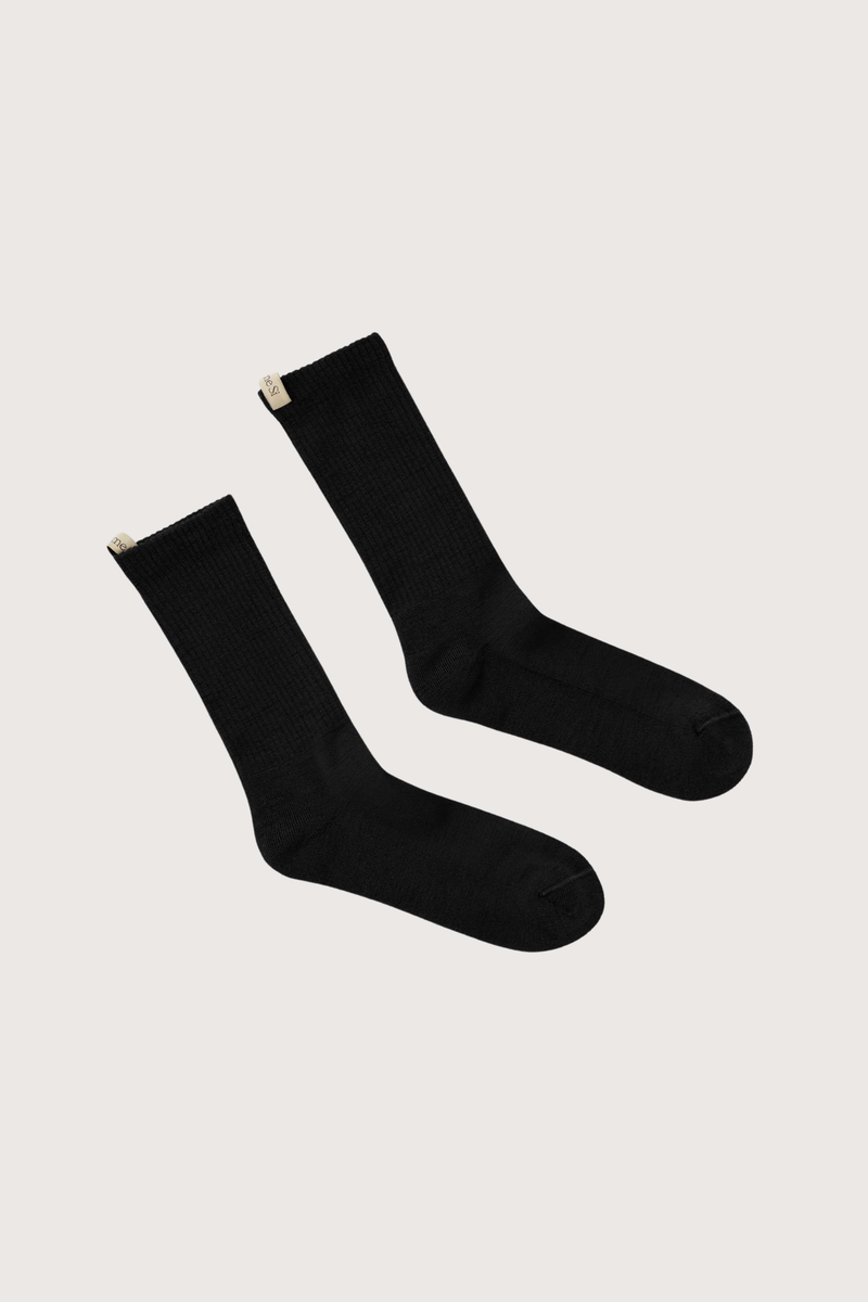 flat lay The Merino Tube Sock Black Tube sock
Comfort and performance
68% Merino Wool, 30% Nylon, 2% Elastane
Terry cushioned footbed
With logo ribbon tab