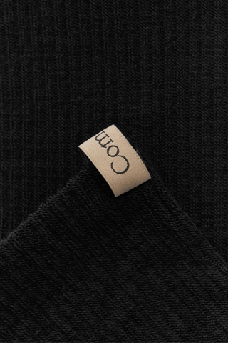 close up pull tab detail for The Merino Tube Sock Black Tube sock
Comfort and performance
68% Merino Wool, 30% Nylon, 2% Elastane
Terry cushioned footbed
With logo ribbon tab