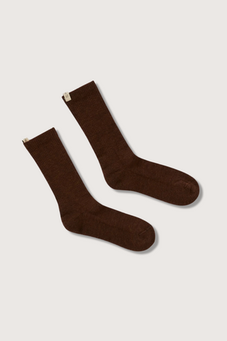 flat lay The Merino Tube Sock Cocoa wool tube style with decorative logo ribbon tab