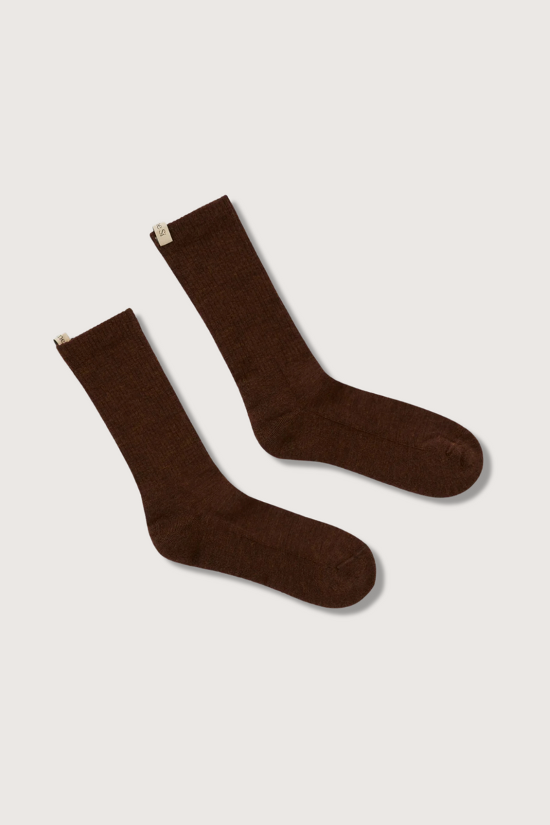 flat lay The Merino Tube Sock Cocoa wool tube style with decorative logo ribbon tab