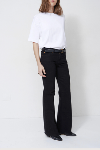 side profile model wearing The Mid Rise Crease Jean - Stretch Mid rise
Flare leg
32” inseam
Italian stretch
Overdyed black
99% Regenerative Cotton 1% Elastane