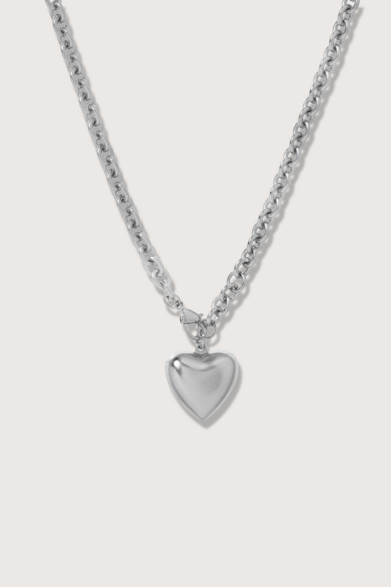 flat lay The Mini Puff Heart Short Necklace Silver