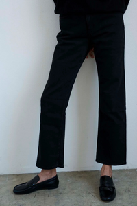 model wearing The Penny Loafer Black leather upper soft leather thin leather sole