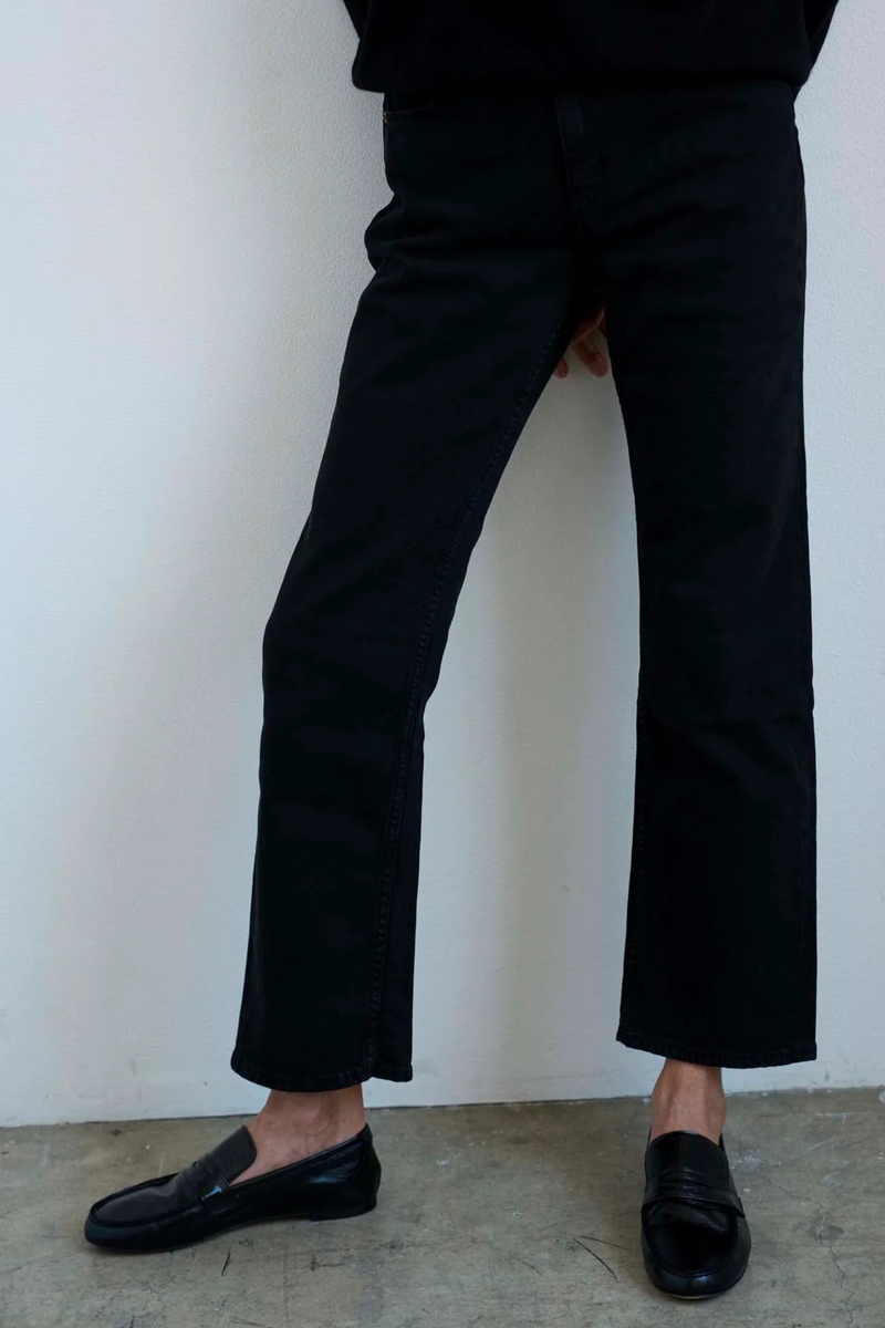 model wearing The Penny Loafer Black leather upper soft leather thin leather sole