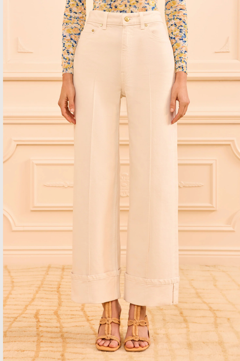 front profile model wearing The Stretch Genevieve Jean Cowrie white Cowrie white denim
Seams down the center front
Exaggerated folded cuffs
Stretch denim
High-rise, wide leg