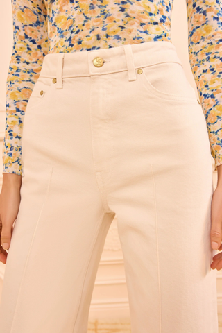 close up pocket and button detail for The Stretch Genevieve Jean Cowrie white Cowrie white denim
Seams down the center front
Exaggerated folded cuffs
Stretch denim
High-rise, wide leg