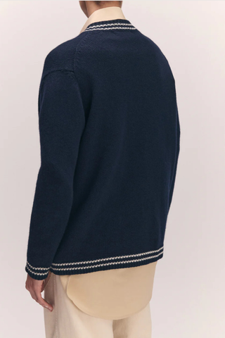back profile model wearing The Stripe Trim V-Neck Cardigan navy white lambswool  White with Navy Stripe Trim
slouchy, oversized fit, v-neck, long sleeve