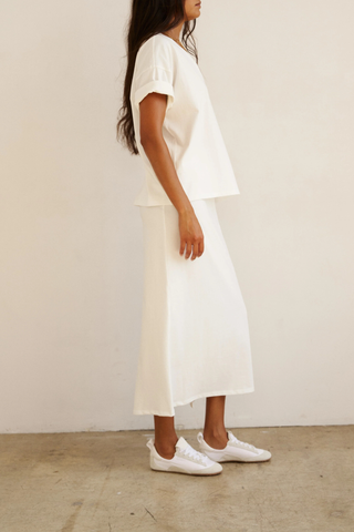side profile model wearing The V Tee White Drop shoulder tee
Wide V-neck
Dolman shaped body
Lose shape
100% Cotton