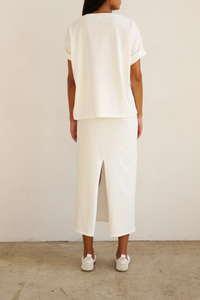 back profile model wearing The V Tee White Drop shoulder tee
Wide V-neck
Dolman shaped body
Lose shape
100% Cotton