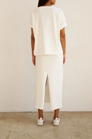 back profile model wearing The V Tee White Drop shoulder tee
Wide V-neck
Dolman shaped body
Lose shape
100% Cotton
