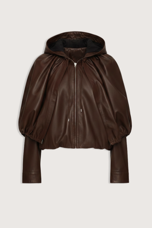 flat lay Thompson Leather Cape Jacket brown 
bubble hem
Adjustable drawstrings
attached hood
Self-100% lamb leather | Lining-100% polyester
Front zipper
Oversized, relaxed fit
100% Lamb Leather