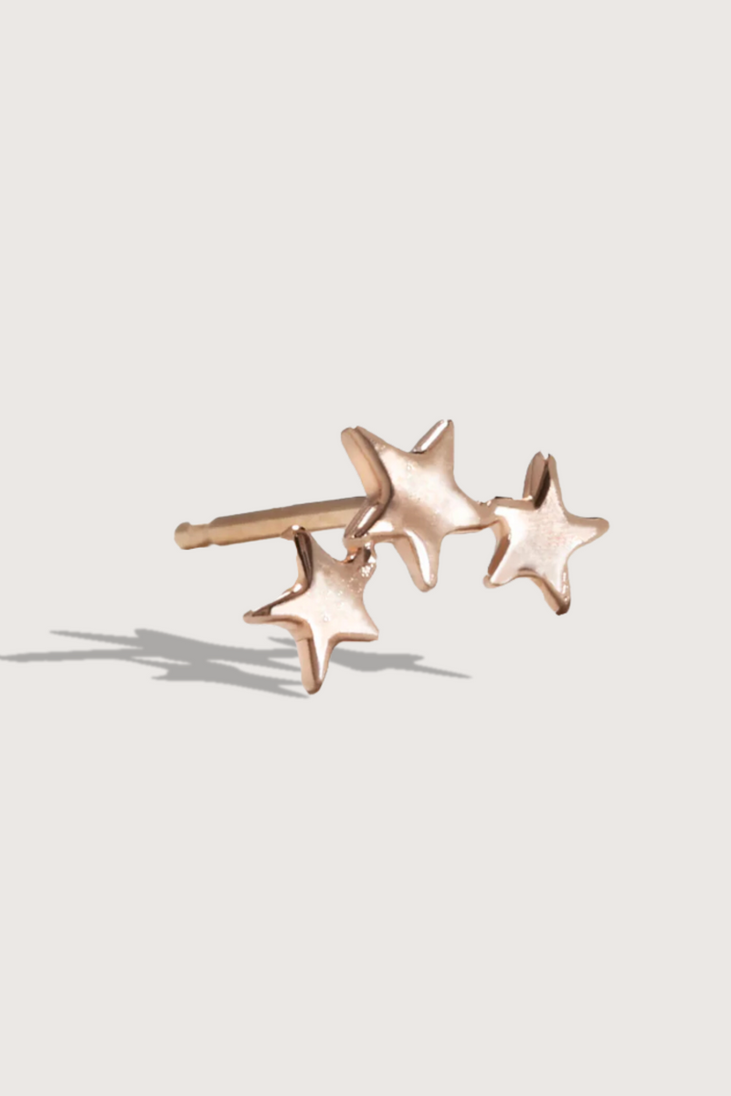 flat lay Three Twinkling Star Earring 14k gold