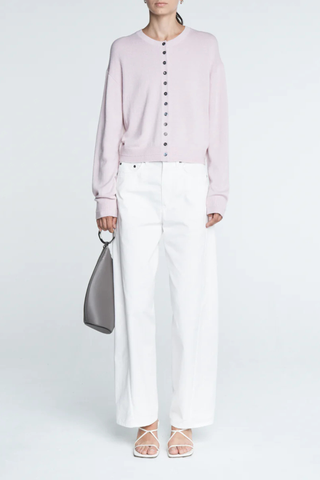 front profile model wearing Tiny Button Cardigan Powder Pink Relaxed fit
Drop shoulder
Multiple contrasting, tiny shell buttons at the center front
Long sleeve cardigan
Cashmere Cotton blend
