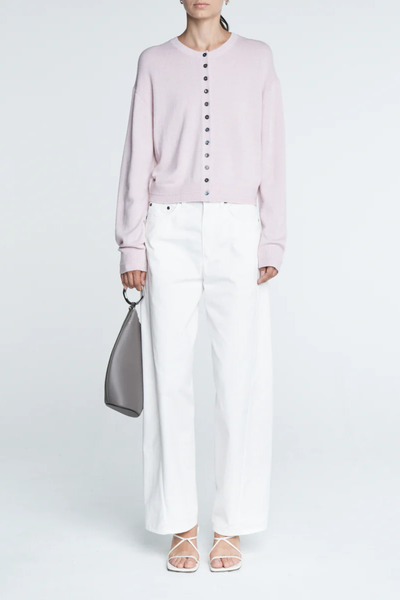 front profile model wearing Tiny Button Cardigan Powder Pink Relaxed fit
Drop shoulder
Multiple contrasting, tiny shell buttons at the center front
Long sleeve cardigan
Cashmere Cotton blend