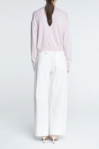 back profile model wearing Tiny Button Cardigan Powder Pink Relaxed fit
Drop shoulder
Multiple contrasting, tiny shell buttons at the center front
Long sleeve cardigan
Cashmere Cotton blend