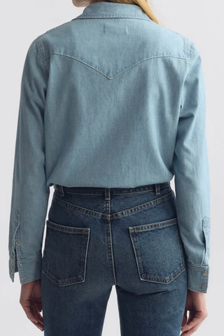 Back profile model wearing Travis shirt chambray indigo Classic denim shirt
Pearl snaps
Classic Western details
100% Cotton light-weight denim