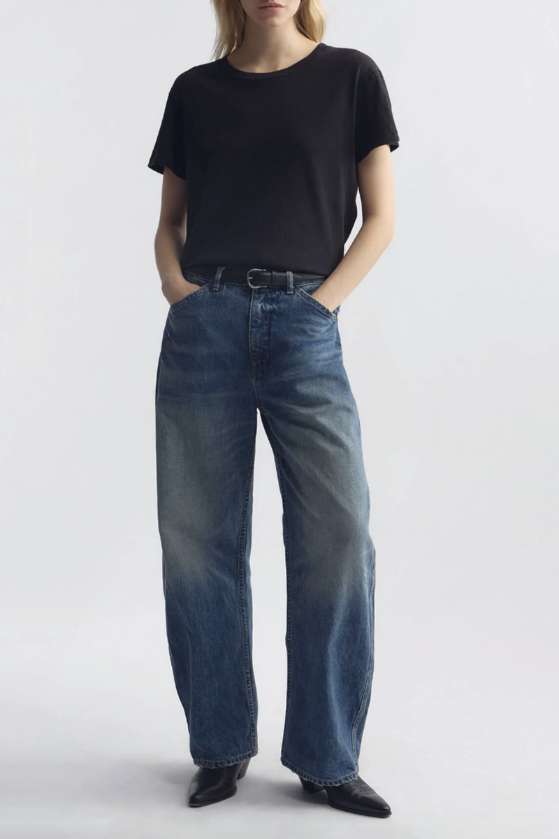 front profile model wearing Tribeca Jean Rose Bowl mid wash blue cotton Mid-rise barrel leg
Japanese stretch denim
Curved silhouette
Front slant pockets
Coin pocket detail
Zip fly
Shank closure
Back patch pockets with topstitching
Belt loops