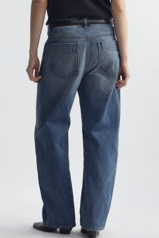 back profile model wearing Tribeca Jean Rose Bowl mid wash blue cotton Mid-rise barrel leg
Japanese stretch denim
Curved silhouette
Front slant pockets
Coin pocket detail
Zip fly
Shank closure
Back patch pockets with topstitching
Belt loops